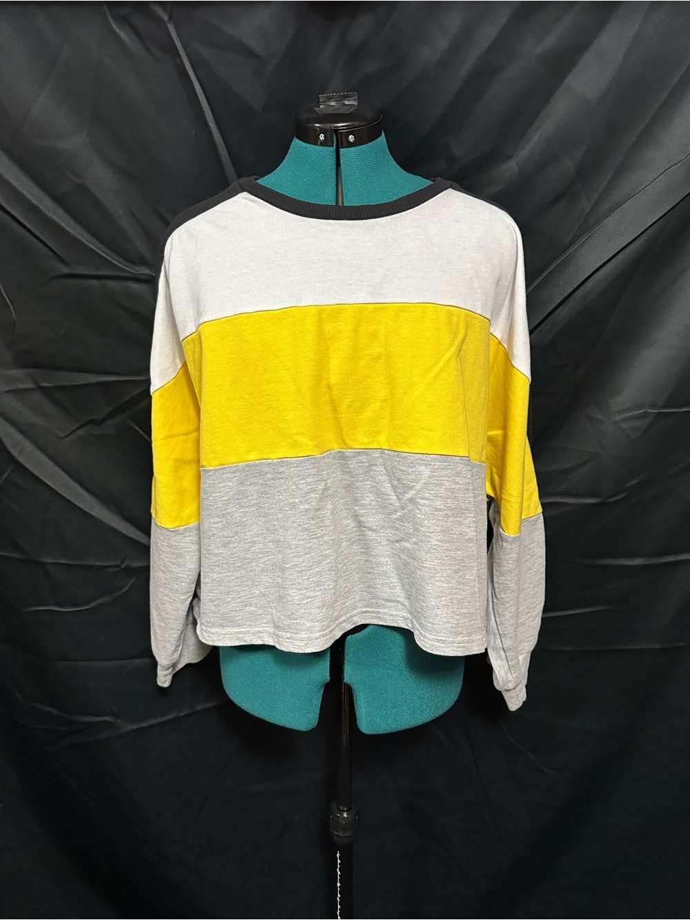 White, yellow, and grey sweater top
